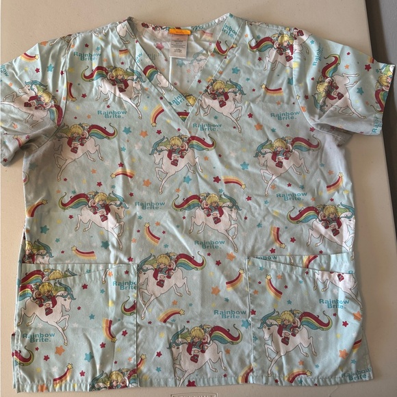 Rainbow Brite Women's Light Blue Scrub Top with Unicorn and Rainbow Design - Picture 1 of 4